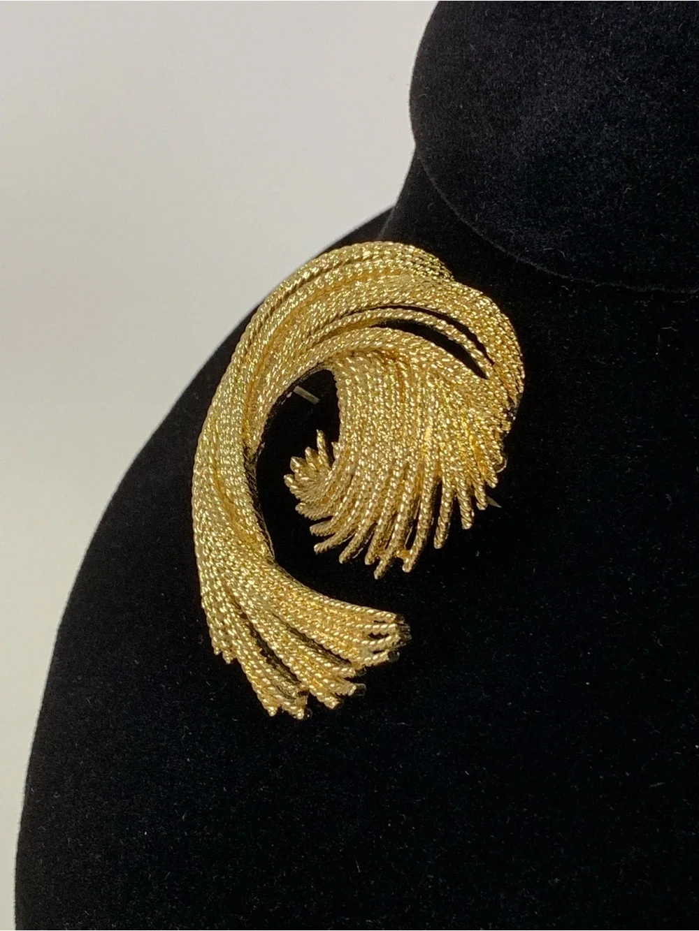Vintage Monet Gold Tone Textured Swirl Brooch